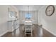 Formal dining room with large table, hardwood floors, and chandelier at 11633 Norfolk St, Commerce City, CO 80022