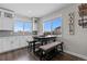 Kitchen nook with built-in bench seating and a table at 11633 Norfolk St, Commerce City, CO 80022