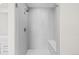 Large walk-in shower with subway tile and bench at 11633 Norfolk St, Commerce City, CO 80022