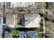 Aerial view of a home with well-maintained roof, lush lawn, and mature trees, showcasing a desirable neighborhood at 925 N Emerson St, Denver, CO 80218
