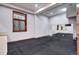 Finished basement area with rubber flooring, recessed lights and a window at 925 N Emerson St, Denver, CO 80218