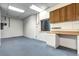 Finished basement with a built in work bench, cabinets and shelving at 925 N Emerson St, Denver, CO 80218