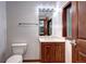 Bathroom with a wooden vanity and a view of the hallway at 925 N Emerson St, Denver, CO 80218