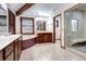 Bathroom with custom wood cabinets, a large tub, and a glass shower stall at 925 N Emerson St, Denver, CO 80218