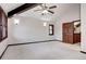 Bright bedroom featuring a vaulted ceiling and decorative sconces at 925 N Emerson St, Denver, CO 80218