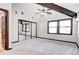 Bright bedroom featuring a vaulted ceiling with exposed beams and a mirrored closet at 925 N Emerson St, Denver, CO 80218