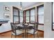Cozy breakfast nook with a round table and natural lighting from surrounding windows at 925 N Emerson St, Denver, CO 80218