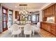 Dining room featuring stylish table setting with wood floors and large windows at 925 N Emerson St, Denver, CO 80218