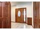 Elegant foyer showcases a wood door with glass, tile flooring, and custom cabinet at 925 N Emerson St, Denver, CO 80218