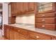 Close up on the kitchen's granite countertops with wood cabinets and drawers at 925 N Emerson St, Denver, CO 80218