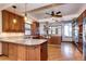 Spacious kitchen with island, granite countertops, hardwood floors, and stainless steel appliances at 925 N Emerson St, Denver, CO 80218