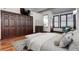 Main bedroom showcases hardwood floors, decorative dresser, and closet space at 925 N Emerson St, Denver, CO 80218
