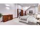Spacious main bedroom featuring an ensuite bathroom and stairs to another level at 925 N Emerson St, Denver, CO 80218