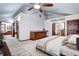Carpeted primary bedroom with a wet bar, ceiling fan, and ensuite bathroom at 925 N Emerson St, Denver, CO 80218