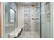 Modern glass shower with a built-in bench and rainfall shower head at 925 N Emerson St, Denver, CO 80218