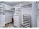 Walk-in closet with custom white shelving and drawers, providing ample storage space at 925 N Emerson St, Denver, CO 80218
