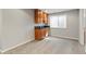 Basement bar area with dark countertops and wood cabinets, conveniently located near other living areas at 10533 Redcone Way, Highlands Ranch, CO 80130