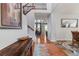 Elegant entryway with hardwood floors, staircase, and view into the living room at 10533 Redcone Way, Highlands Ranch, CO 80130