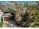 Aerial view of home featuring a lush front lawn, large trees, and a two-car garage at 2838 Forest St, Denver, CO 80207