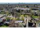 An aerial view showing the neighborhood with the city in the distance at 2838 Forest St, Denver, CO 80207