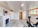 Finished basement featuring a fireplace, closet, and window at 2838 Forest St, Denver, CO 80207