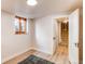 Basement room with a window and an open doorway at 2838 Forest St, Denver, CO 80207