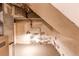 Unfinished basement space with exposed pipes and textured walls and floors at 2838 Forest St, Denver, CO 80207