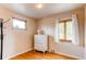 Bright bedroom features hardwood floors, and windows with natural light, cozy and quaint at 2838 Forest St, Denver, CO 80207