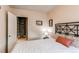Cozy bedroom features a closet, neutral walls, and a comfortable queen-size bed with stylish linens at 2838 Forest St, Denver, CO 80207