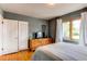 Cozy bedroom features hardwood floors, ample natural light and closet with paneled doors at 2838 Forest St, Denver, CO 80207