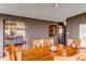Dining area featuring wood table, and a view into the living room and kitchen at 2838 Forest St, Denver, CO 80207