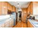 Functional kitchen showcasing wood cabinets, modern appliances, and ample counter space at 2838 Forest St, Denver, CO 80207