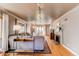 Bright living room featuring hardwood floors, a fireplace, and generous natural light at 2838 Forest St, Denver, CO 80207