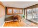 Sun-filled office includes hardwood floors, sliding door, and a charming desk and chair at 2838 Forest St, Denver, CO 80207