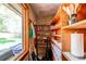 Walk-in pantry with abundant shelving and natural light from the window at 2838 Forest St, Denver, CO 80207