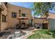 Brick patio with a dining set, hot tub, and a peaceful outdoor lounge area at 2838 Forest St, Denver, CO 80207