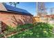 Yard with garden, grass, flowers, and brickwork at 2838 Forest St, Denver, CO 80207