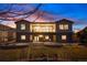 Well-manicured backyard with lush lawn, and open patio space at 12371 Red Fox Way, Broomfield, CO 80021