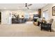 Finished basement featuring a bar with seating, modern fireplace, and neutral carpeting for a cozy feel at 12371 Red Fox Way, Broomfield, CO 80021