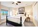 Cozy bedroom with a window seat, black bed frame, and soft natural light, creating a relaxing space at 12371 Red Fox Way, Broomfield, CO 80021