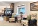 Cozy sitting area features a stone fireplace and window with natural light at 12371 Red Fox Way, Broomfield, CO 80021