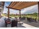 Inviting outdoor patio area with stylish seating and a scenic view of the community at 12371 Red Fox Way, Broomfield, CO 80021