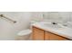 Bathroom featuring a single sink vanity, a white toilet, and a grab bar at 2062 S Xenia Way, Denver, CO 80231