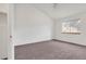 Spacious bedroom with plush carpeting, a ceiling fan, and a bright window at 2062 S Xenia Way, Denver, CO 80231