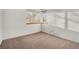 Bedroom featuring neutral carpet, white walls, and natural light from two windows at 2062 S Xenia Way, Denver, CO 80231