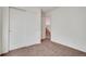 Bedroom features neutral carpet and a closet with sliding doors at 2062 S Xenia Way, Denver, CO 80231