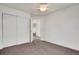 Bedroom featuring neutral carpet, white walls, a closet, and ceiling fan at 2062 S Xenia Way, Denver, CO 80231