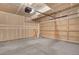 Unfinished garage with concrete floors, garage door and drywall at 2062 S Xenia Way, Denver, CO 80231