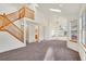 Open-concept living area featuring a staircase, skylights, and plenty of natural light at 2062 S Xenia Way, Denver, CO 80231