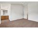 Spacious main bedroom featuring carpet flooring, ceiling fan, and multiple closets at 2062 S Xenia Way, Denver, CO 80231